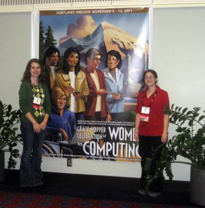 Emily and Lena in front of the GHC 2011 poster